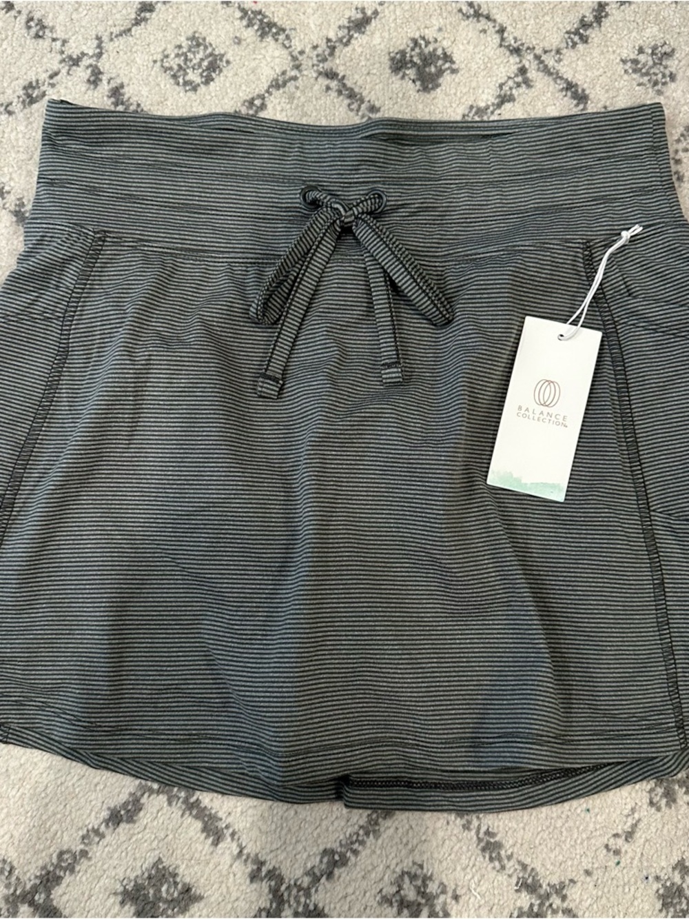 NEW Balance Collection Striped Active Skort in Charcoal and Black. Size Medium